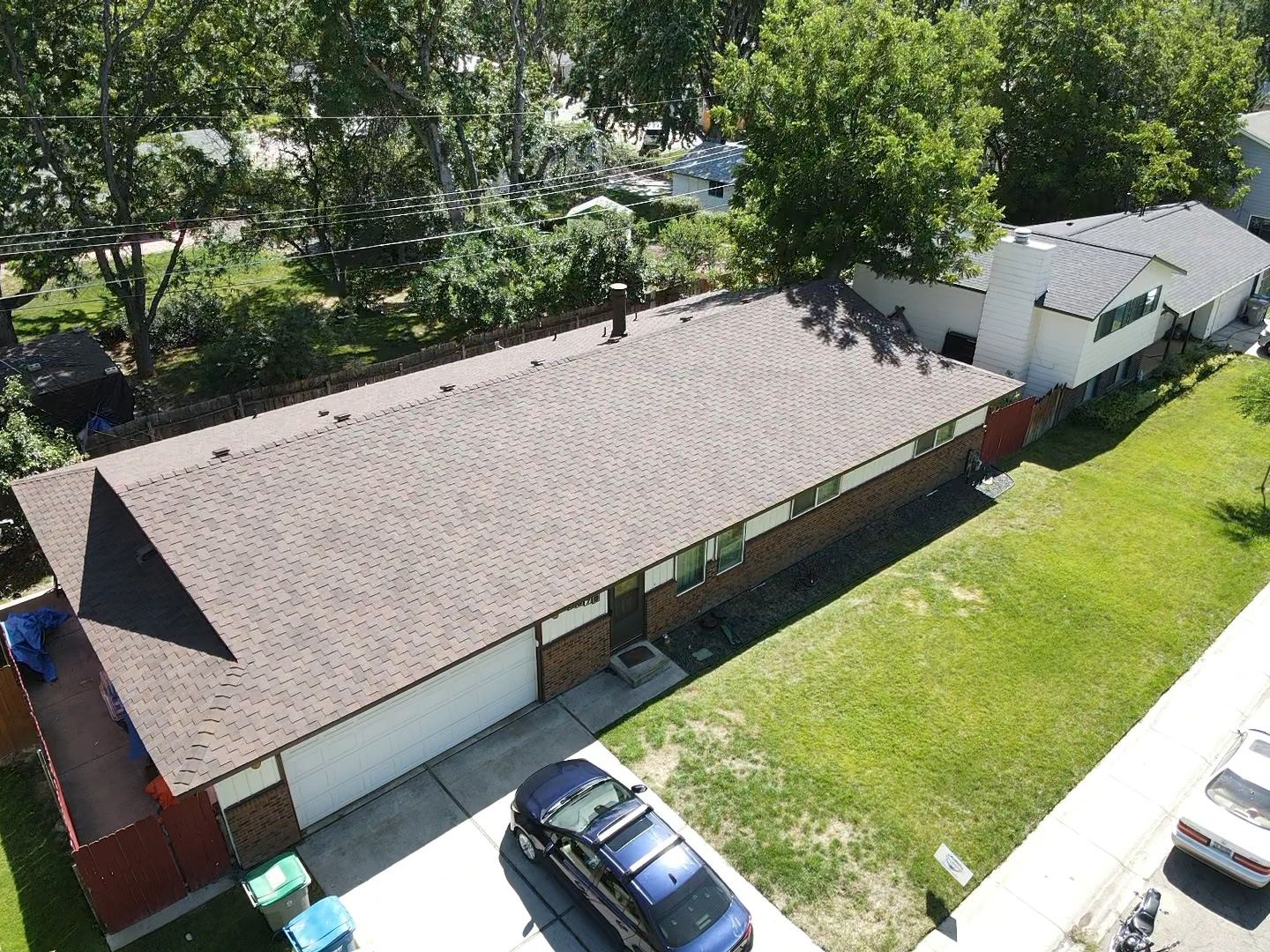 A brick ranch home with a finished reroof