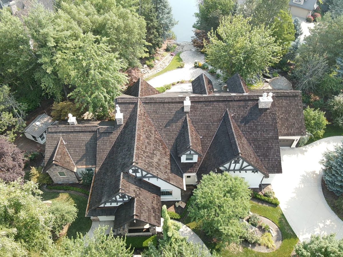 Aerial view of the cedar shake estate roof showing dormers and chimneys