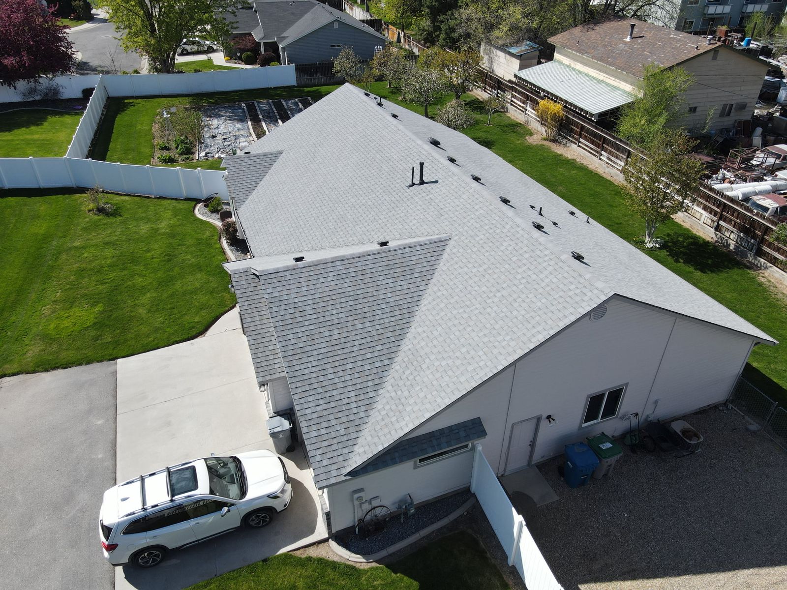 Gray shingle over a green lawn