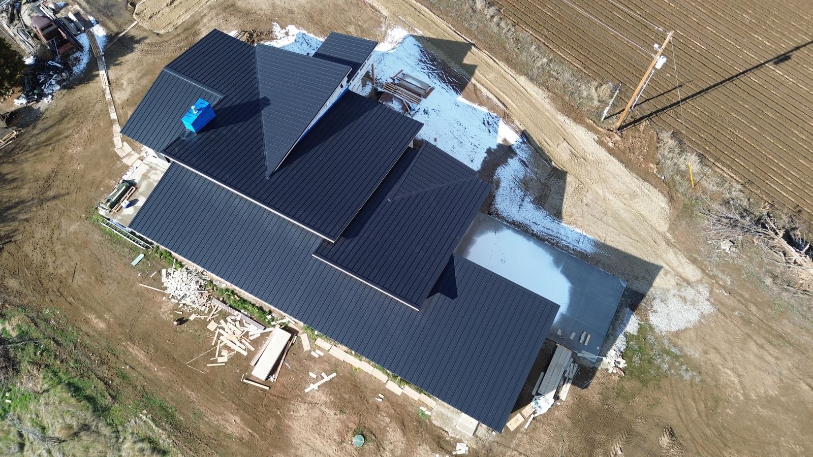 Standing seam on a new home, from the air