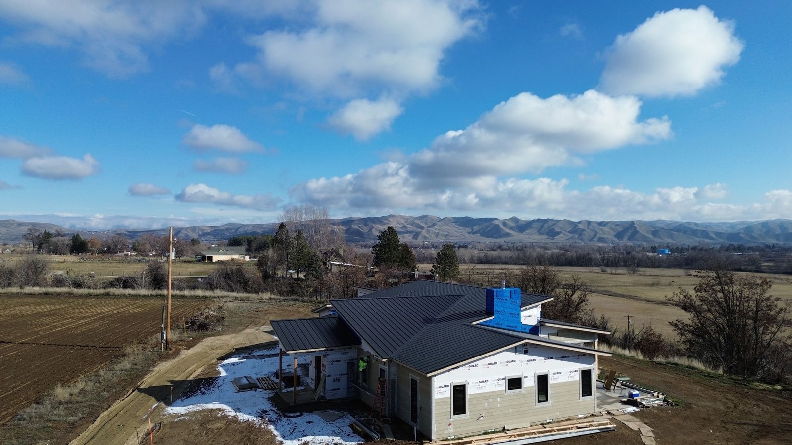 A standing seam metal roof in winter